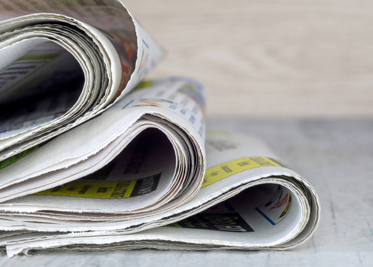 a small pile of newspapers